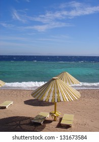 Gorgeous sea and beach scene with turquoise blue waters and summer sky in Dahab Eastern Sinai Peninsula