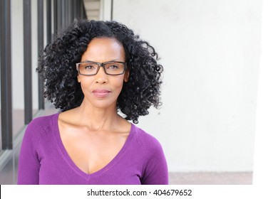Gorgeous senior African American woman wearing glasses with copy space 
