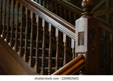 the gorgeous solid wood staircase in the lobby of a London hotel. interior photo. detail.