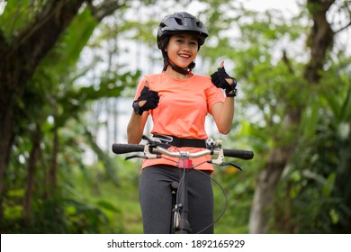 Gorgeous strong young asian woman cyclist  - Powered by Shutterstock