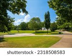 A gorgeous summer landscape at Coolidge Park with lush green trees, grass and plants and blue sky and clouds in Chattanooga Tennessee USA