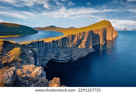 Gorgeous summer scene of Sorvagsvatn lake on Vagarisland. Picturesque morning view of Faroe Islands, Denmark, Europe. Nice Atlantic seascape. Beauty of nature concept background.