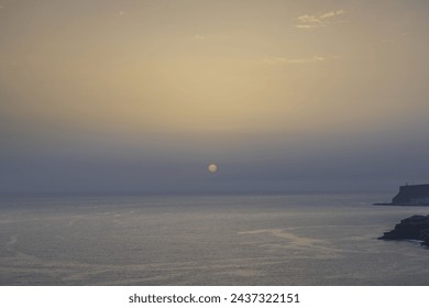 Gorgeous sunset over the Atlantic Ocean, framing a breathtaking coastal mountain view in Spain. - Powered by Shutterstock