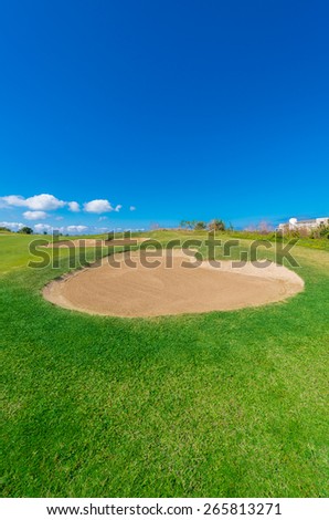 Gorgeous view at the beautiful golf course with sand bunkers. Vertical.