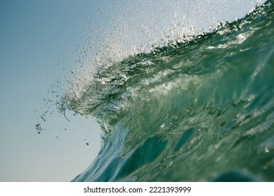 A Gorgeous View Of A Bright Green Sea With Vicious Tides Rising And Falling On Themselves