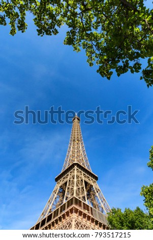 Similar – Eiffel Tower in green trees on blue sky