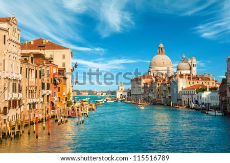 Gorgeous view of the Grand Canal and Basilica Santa Maria della Salute during sunset with interesting clouds, Venice, Italy