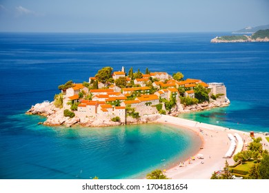 Gorgeous view of the small islet Sveti Stefan. Location place Montenegro, Adriatic sea, Balkans, Europe. Image of popular european travel destination. Summer vacation. Discover the beauty of earth.