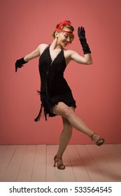 Gorgeous Vintage 1920s Lady Dancing The Charleston In A Black Dress With Headband

