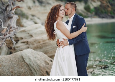 Gorgeous Wedding Couple Doing Photo Shoot In The Morning On The Beach In Greece