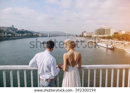 gorgeous wedding couple walking in the old city of Budapest
