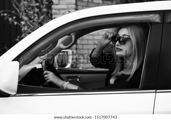 Gorgeous woman with a car, luxury style,\
concept lady and\
automobile