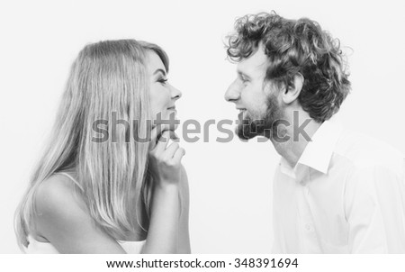 Similar – Young couple kissing in a studio portrait