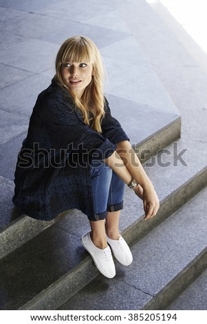 Similar – Image, Stock Photo Blonde girl wearing white sweater smiling in the street