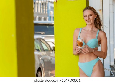 A gorgeous woman reclines on a sandy beach, her bikini accentuating her golden tan. She enjoys an ice cream cone, the sun's warmth embracing her, while waves gently whisper at the shore. - Powered by Shutterstock