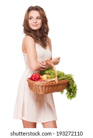 Gorgeous Young Brunette Woman With Basket Of Fresh Produce Isolated On White Background.