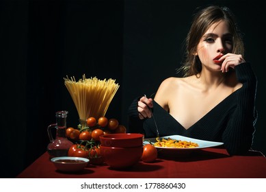 Gorgeous Young Brunette Woman Having Italian Food. Seductive Cheeky Girl With Plate Of Pasta Eats Pasta With Ketchup