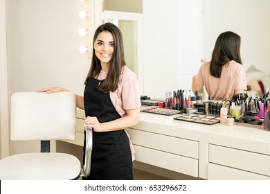 Gorgeous Young Business Owner Pulling Up A Chair And Greeting Customers Into Her Beauty Salon