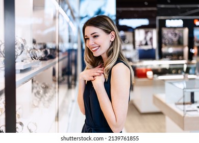 Gorgeous Young Woman Enjoying In Expensive Jewelry Store. Fashion Style And Elegance Concept.