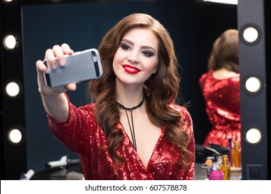 Gorgeous Young Woman With Glamorous Make-up Making Selfie On Smartphone 