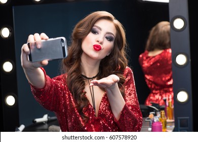 Gorgeous Young Woman With Glamorous Make-up Making Selfie On Smartphone 