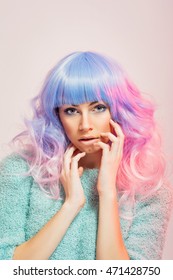 Gorgeous Young Woman With Pastel Blue And Pink Hair. Closeup Portrait Of Teenage Girl With Modern Hairstyle And Hair Color, Posing. Retouched. Studio Lighting.