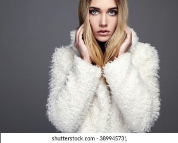 Gorgeous Young Woman In Winter Fashion Wearing A Fur.beautiful Blond Hair Model Girl