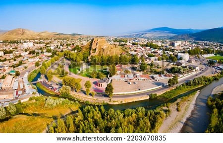 Gori Fortress or Goris Tsikhe aerial panoramic view, Georgia. It is a medieval citadel in Georgia, situated above the city of Gori on a rocky hill.
