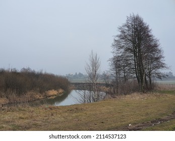 Gorin River In Winter Without Snow On A Foggy Day