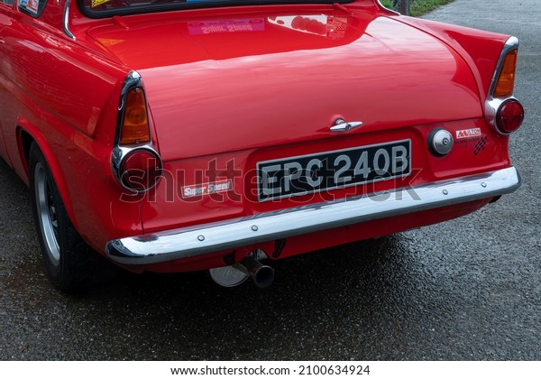 GORING-ON-SEA, WEST SUSSEX, UK - CIRCA 2022\
JANUARY: The rear of a beautiful old 1964 Ford vintage car, rear\
lights and boot or trunk, chrome\
bumper