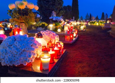GORNA GRUPA, POLAND - NOV 1, 2014: Cemetary at night with colorful candles for All Saints Day in Poland. All Saints' Day is a solemnity celebrated on 1 November by the Catholic Church.