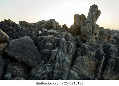 Goseong County, South Korea - November 3, 2024: Intricate and weathered rock formations at Neungpadae capture the morning light, showcasing unique geological features and textures along the coastal. - Powered by Shutterstock