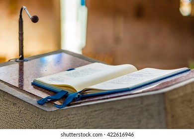 Gospel book open on the concrete pulpit to be read - Shutterstock ID 422616946