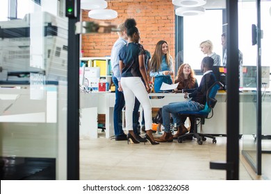 Gossiping Staff At Work. Pleasant Conversation. Tell Funny Stories. Woman With Red Long Hair Is Telling A Joke To Her Friends