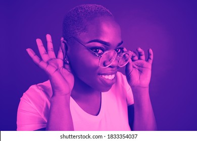Gossips. Close-up portrait of african woman isolated on studio background. Modern and trendy duotone effect. Concept of human emotions, facial expression. Copyspace for ad. People in halftones.