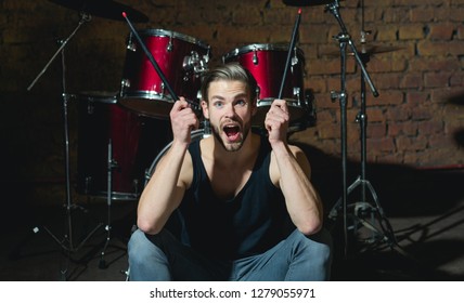 I Got The Beat. Rock Star Or Rocker. Excited Man Sit On Stage At Percussion Instrument. Man Drummer With Musical Instrument. Rock Concert Or Rehearsal In Music Club. Enjoying Instrumental Music.