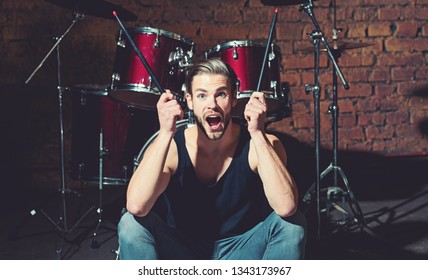 I Got The Beat. Rock Star Or Rocker. Excited Man Sit On Stage At Percussion Instrument. Man Drummer With Musical Instrument. Rock Concert Or Rehearsal In Music Club. Enjoying Instrumental Music.