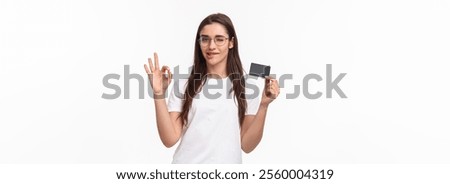Got everything under control. Good-looking carefree, calm woman assure you all good, no problem cause she have credit card, wink and bite lip encourage all ok, white background.