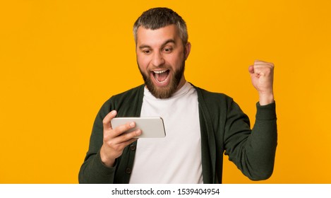 Got Good News. Emotional Middle Aged Man Holding Phone And Clenching Fist, celebrating success, panorama with copy space - Shutterstock ID 1539404954