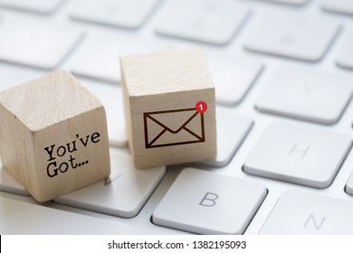 You’ve got mail message on wooden cubes with computer keyboard and e-mail icon suggesting unread message inbox 
