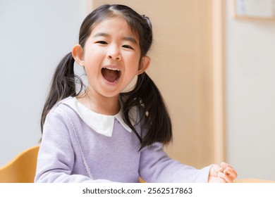 I got it from the study! A toddler looking at the camera with delight