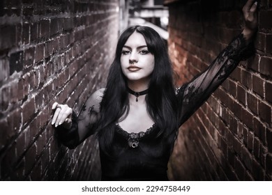 goth girl gothic model alternative girl punk rock lady in alley with focus on face