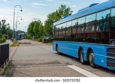 Gothenburg, Sweden - August 19 2020: Two buses meeting at a bus stop