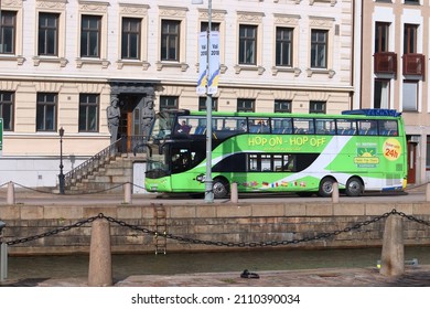 GOTHENBURG, SWEDEN - AUGUST 26, 2018: People ride city sightseeing bus in Gothenburg, Sweden. Gothenburg is the 2nd largest city in Sweden with 1 million inhabitants in the metropolitan area.