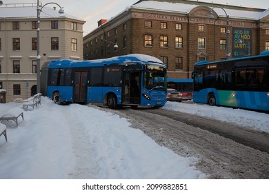 GOTHENBURG, SWEDEN - DECEMBER 3 2021: A bus that got into a skid on a slippery street and is blocking the traffic