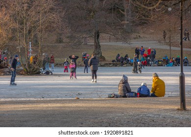 Gothenburg, Sweden - January 30 2021: People skating on a frozen lake in Slottsskogen