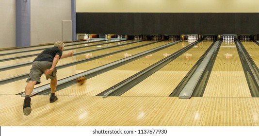 GOTHENBURG, SWEDEN - JULY 18 2018: Lone Older Man Practising Bowling By Himself