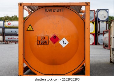 Gothenburg, Sweden - July 24 2022: Orange Universal Tank Container Marked UN 30 1866 Resin Solution Flammable.