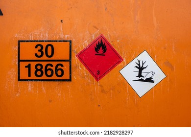 Gothenburg, Sweden - July 24 2022: Orange Universal Tank Container Marked UN 30 1866 Resin Solution Flammable.