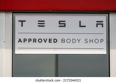 Gothenburg, Sweden - June 25 2022: Tesla Approved Body Shop Sign Outside A Car Workshop.